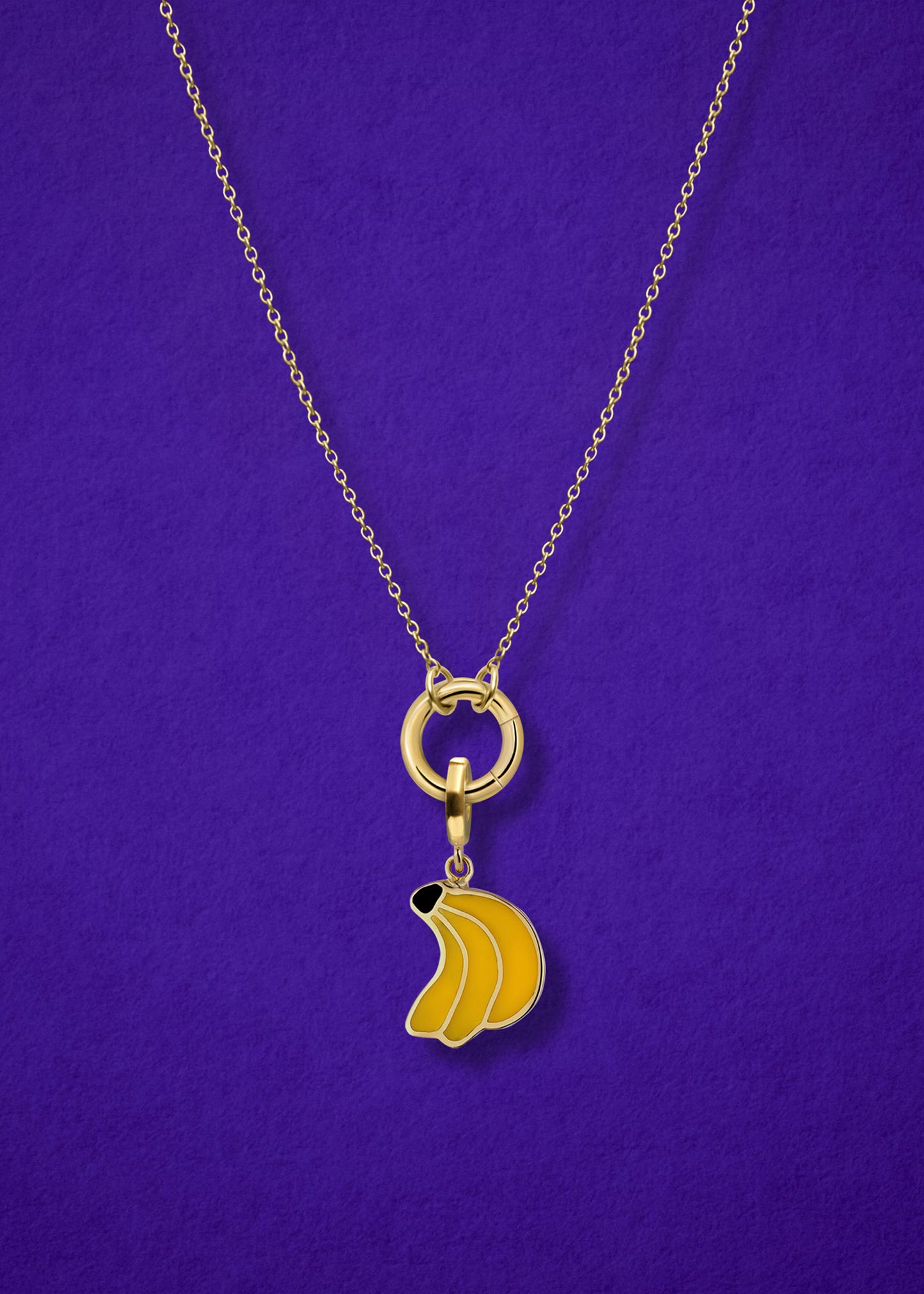 Close-up of the Banana Bliss Charm paired with the Golden Grace Cable Chain, crafted in 14K solid gold by whywhy NYC, for a playful and versatile jewelry look.
