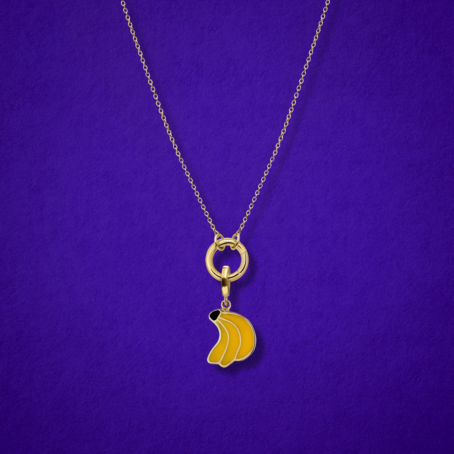 Close-up of the Banana Bliss Charm paired with the Golden Grace Cable Chain, crafted in 14K solid gold by whywhy NYC, for a playful and versatile jewelry look.