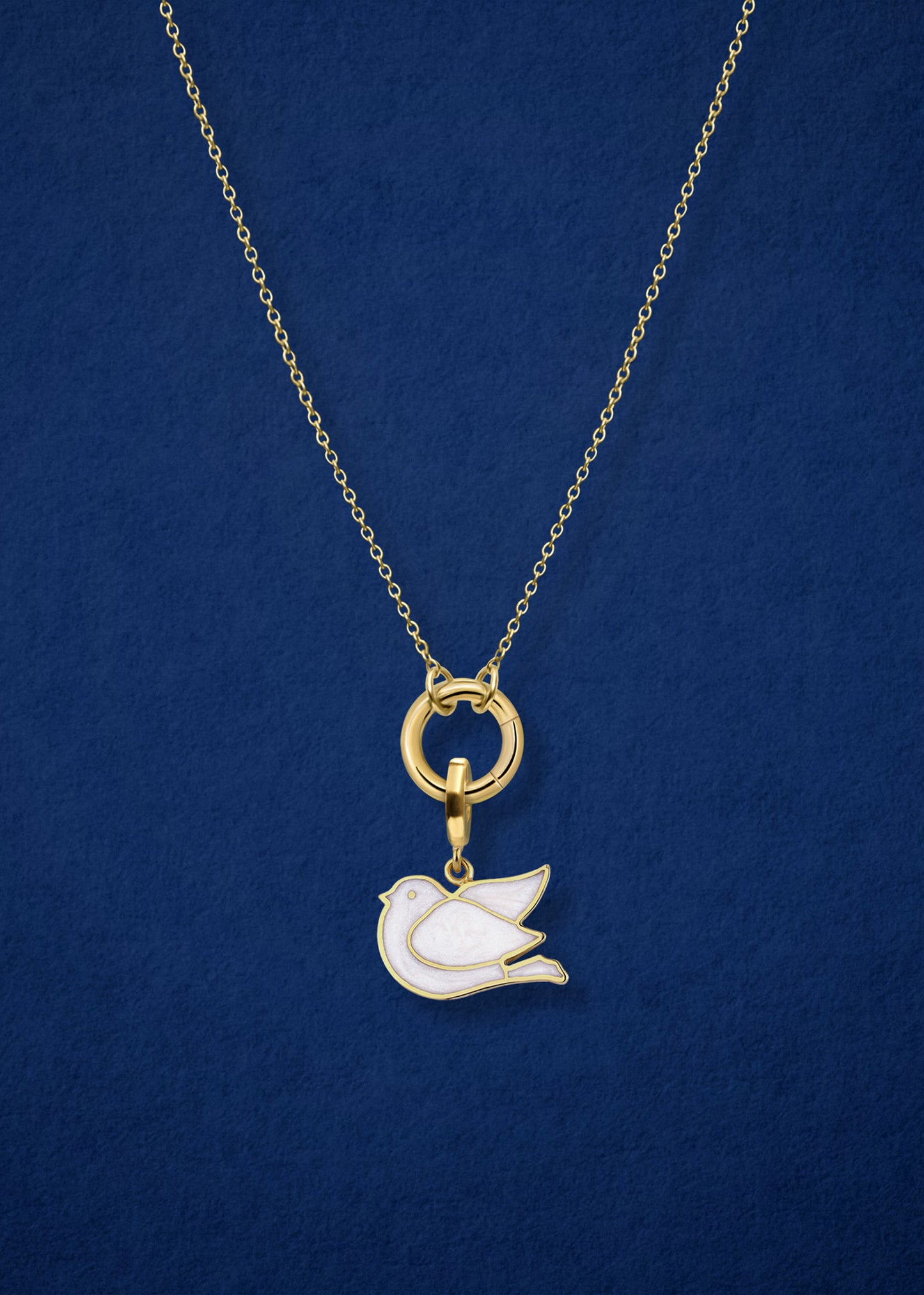 Close-up of the Dove of Hope Charm paired with the Golden Grace Cable Chain, crafted in 14K solid gold by whywhy NYC, for an elegant and symbolic jewelry option.