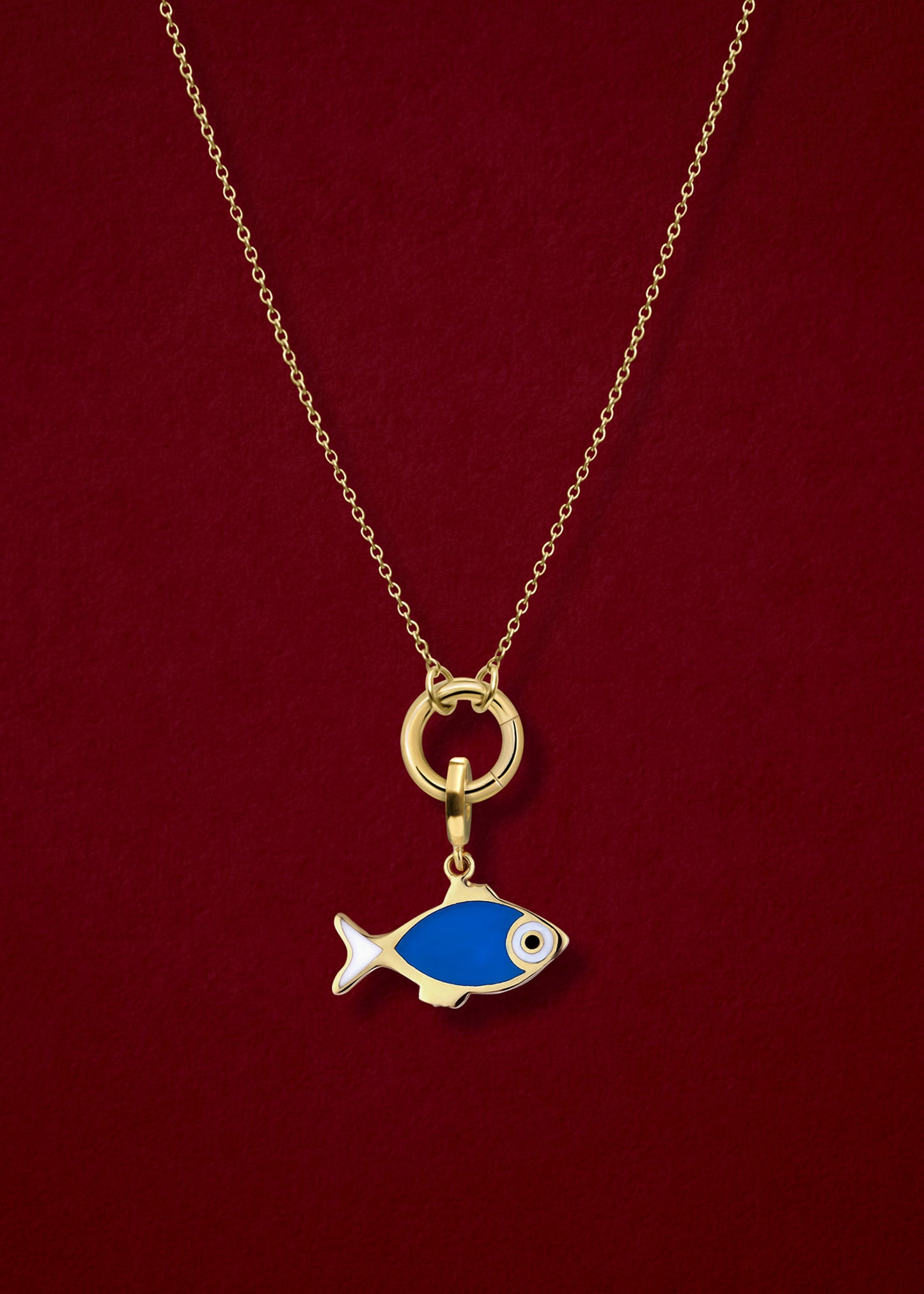 Close-up of the Fishy Wishes Charm paired with the Golden Grace Cable Chain, crafted in 14K solid gold by whywhy NYC, for a whimsical and vibrant jewelry style.