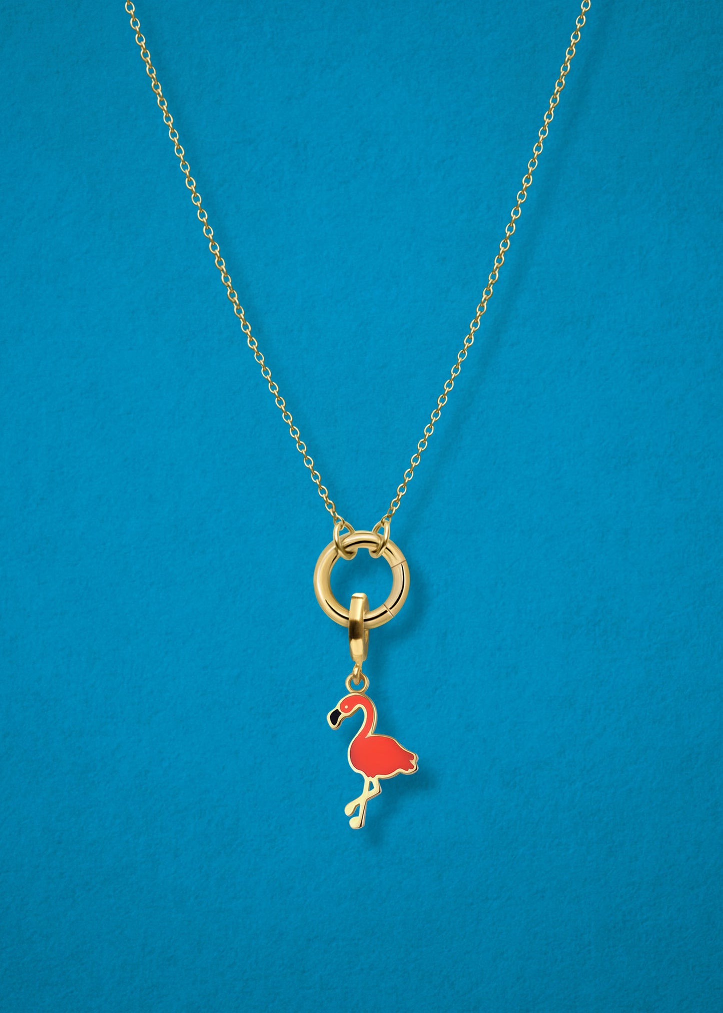 Close-up of the Flamingo Flair Charm paired with the Golden Grace Cable Chain, crafted in 14K solid gold by whywhy NYC, for a bold and tropical jewelry style.