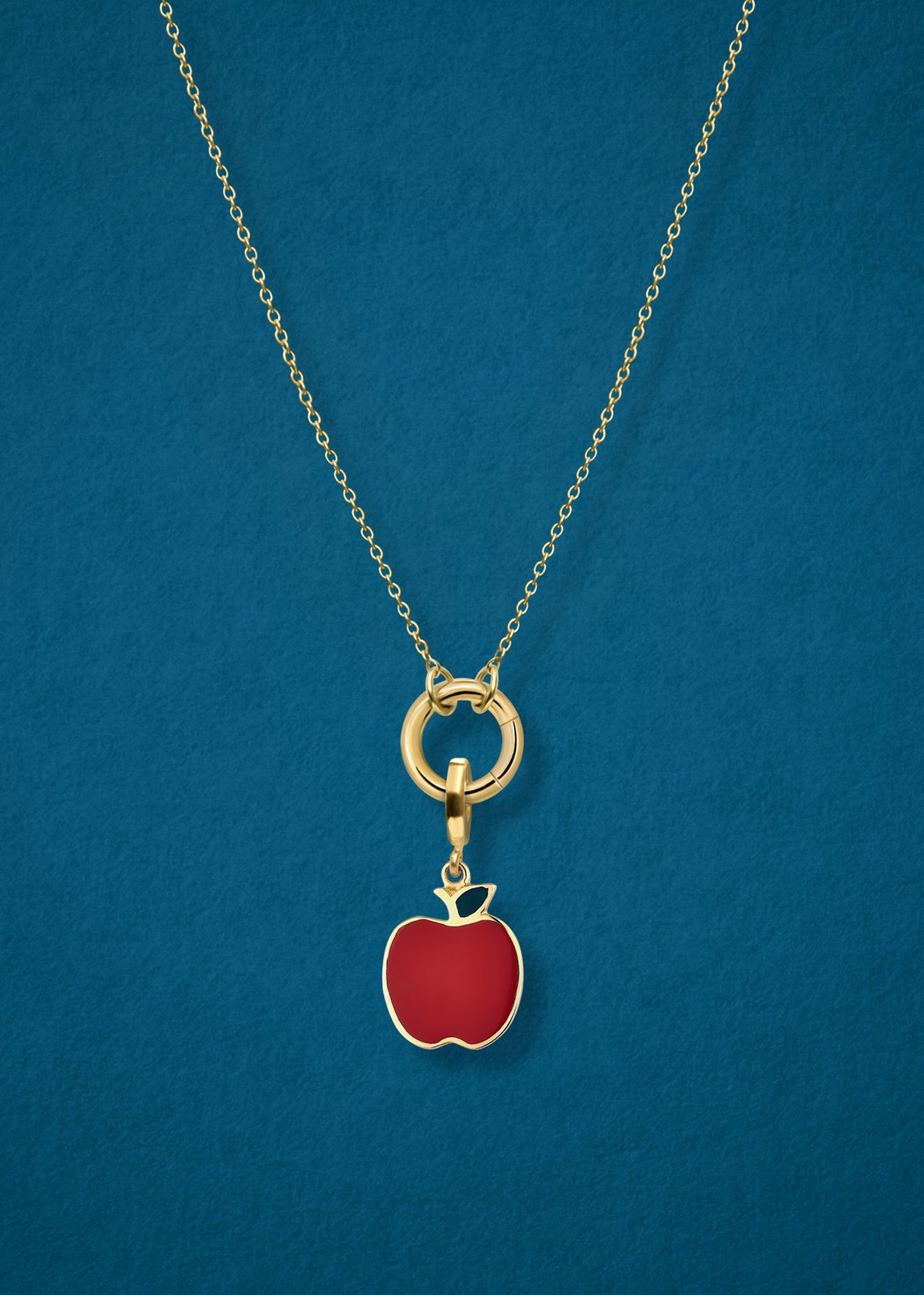 Close-up of the Golden Apple of NYC Charm paired with the Golden Grace Cable Chain, crafted in 14K solid gold by whywhy NYC, for a bold and stylish jewelry option.