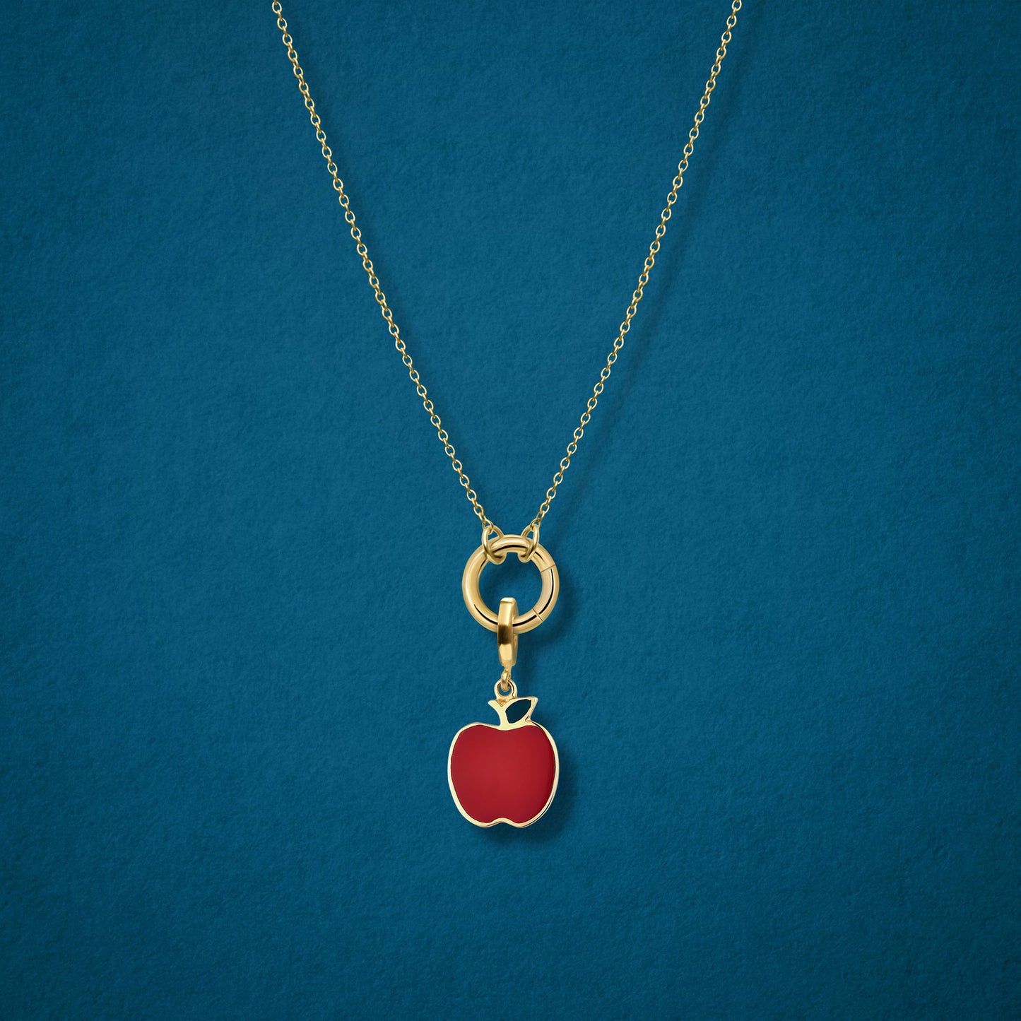 Close-up of the Golden Apple of NYC Charm paired with the Golden Grace Cable Chain, crafted in 14K solid gold by whywhy NYC, for a bold and stylish jewelry option.