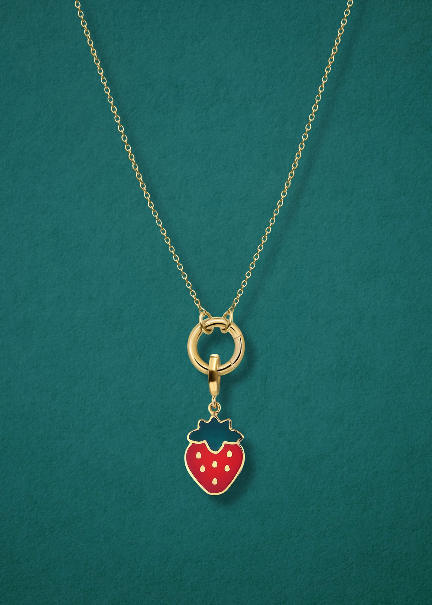 Close-up of the Sweet Strawberry Delight Charm paired with the Golden Grace Cable Chain, crafted in 14K solid gold by whywhy NYC, for a vibrant and playful jewelry style.