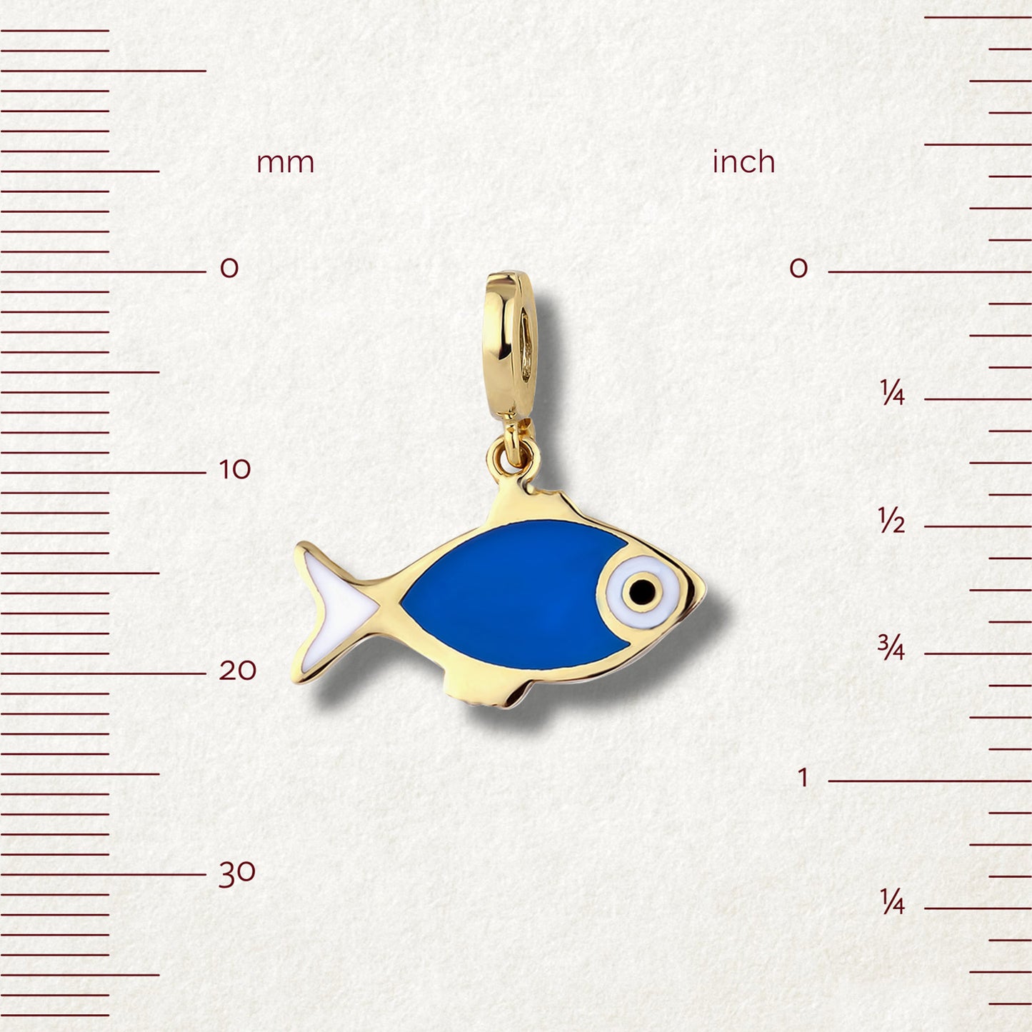 Measurement view of Fishy Wishes Charm by whywhy NYC, 14K gold and enamel fish charm, approx. 21mm length.