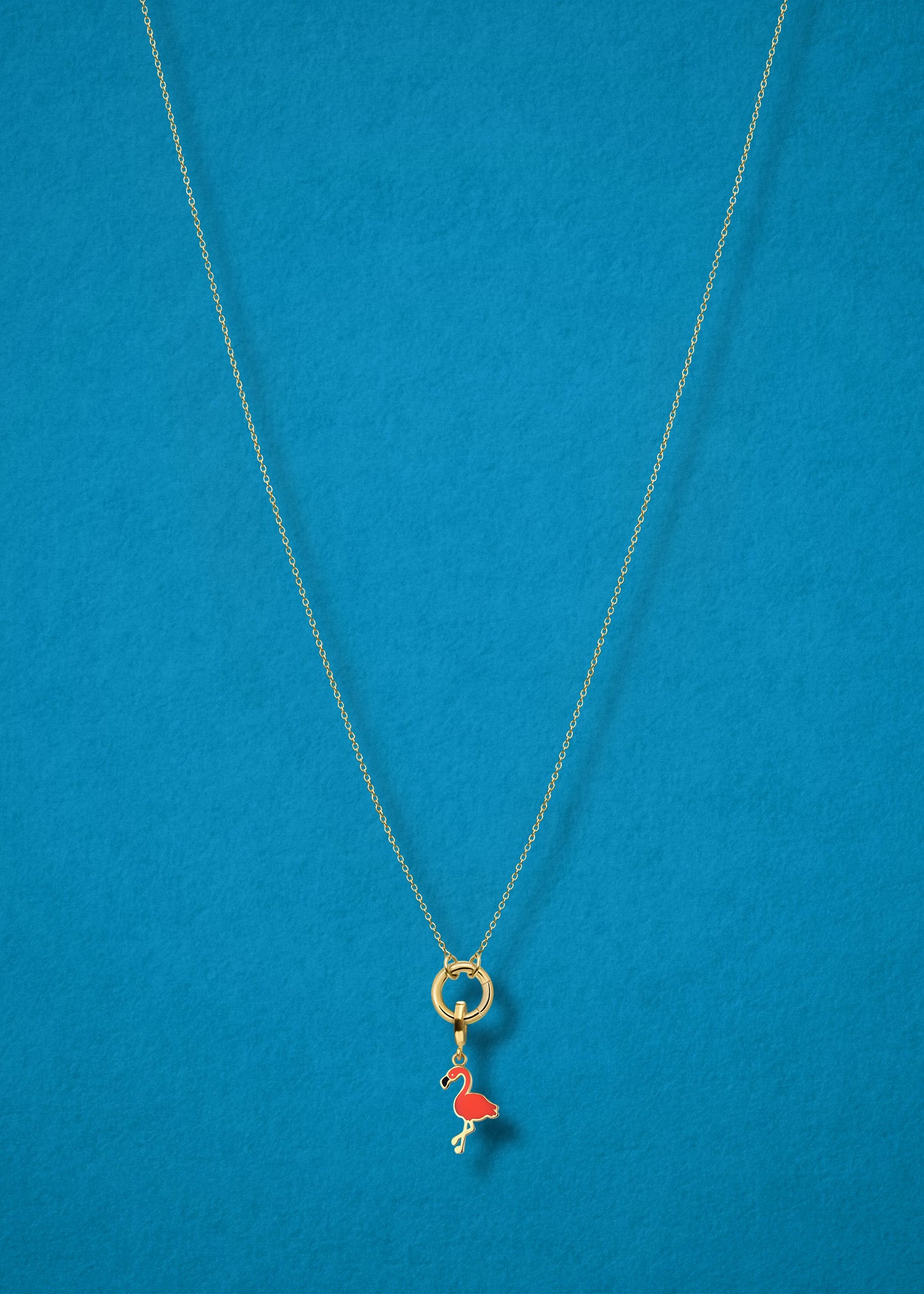 Flamingo Flair Charm and Golden Grace Cable Chain connected with a 14K solid gold charm holder by whywhy NYC for a playful, tropical style.