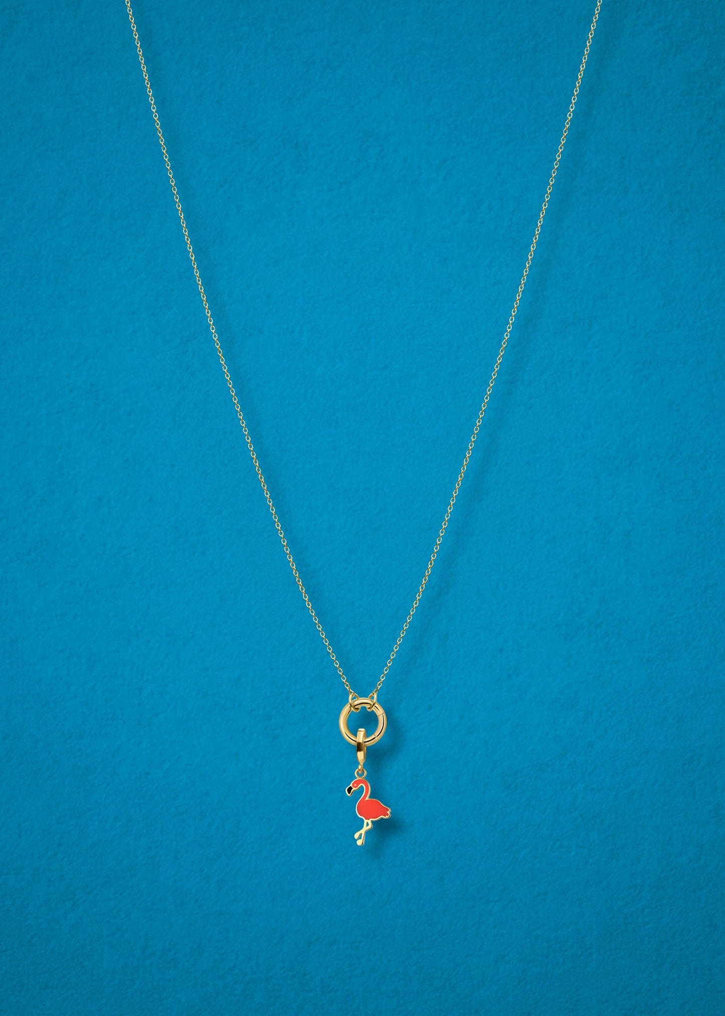 Flamingo Flair Charm and Golden Grace Cable Chain connected with a 14K solid gold charm holder by whywhy NYC for a playful, tropical style.