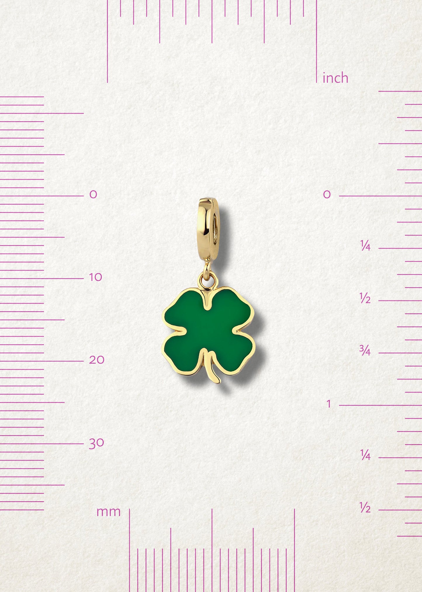 Measurement view of Lucky Clover Charm by whywhy NYC, 14K gold and green enamel, approx. 23mm in length.