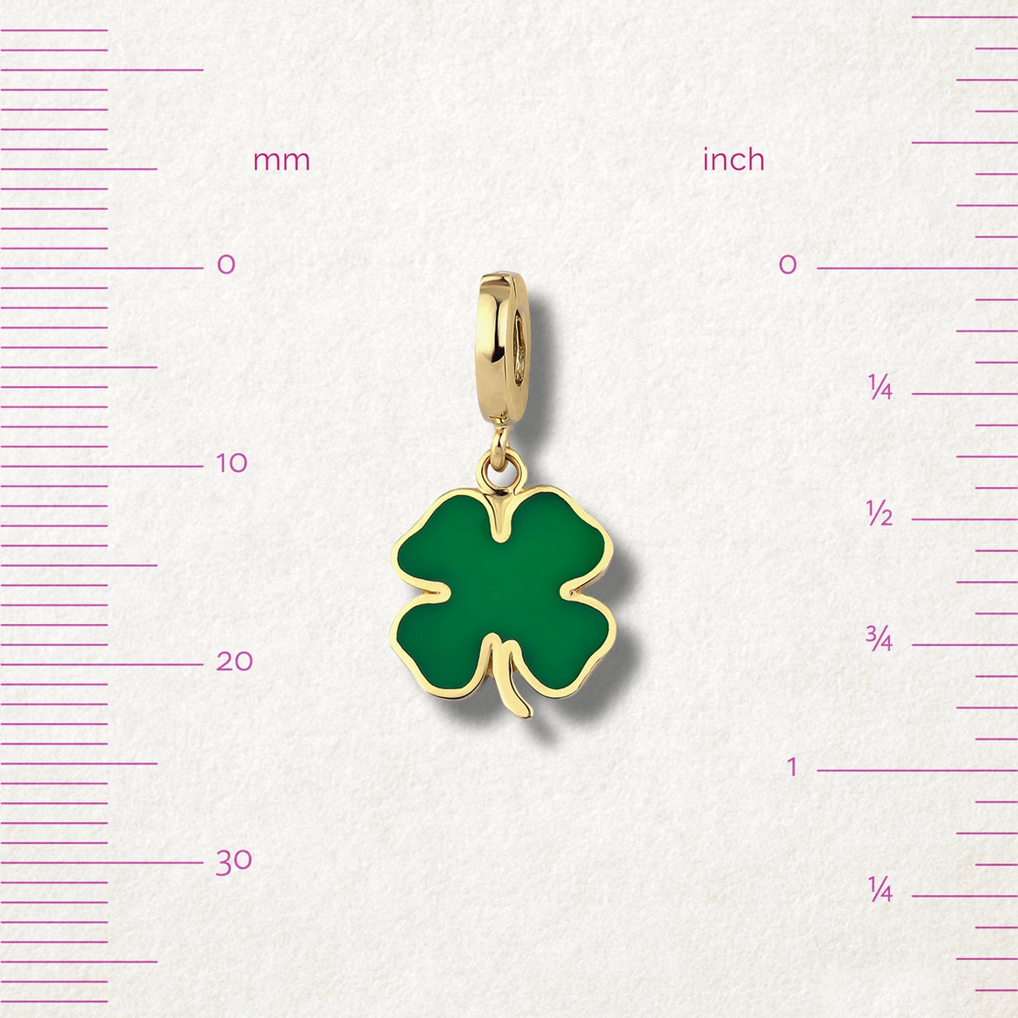 Measurement view of Lucky Clover Charm by whywhy NYC, 14K gold and green enamel, approx. 23mm in length.