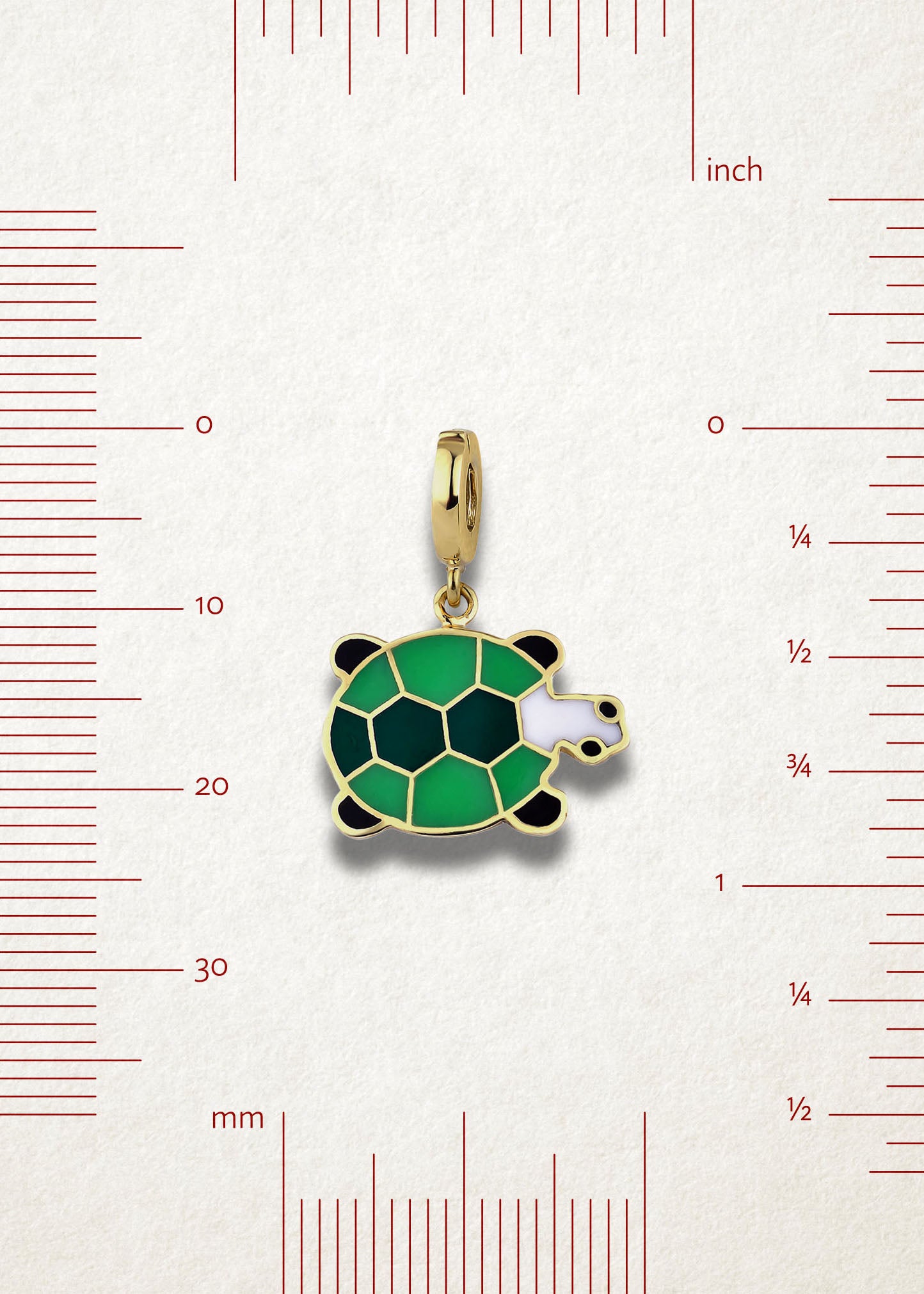 Measurement view of Turtle Treasure Charm by whywhy NYC, 14K solid gold with green enamel, approximately 23mm in length.