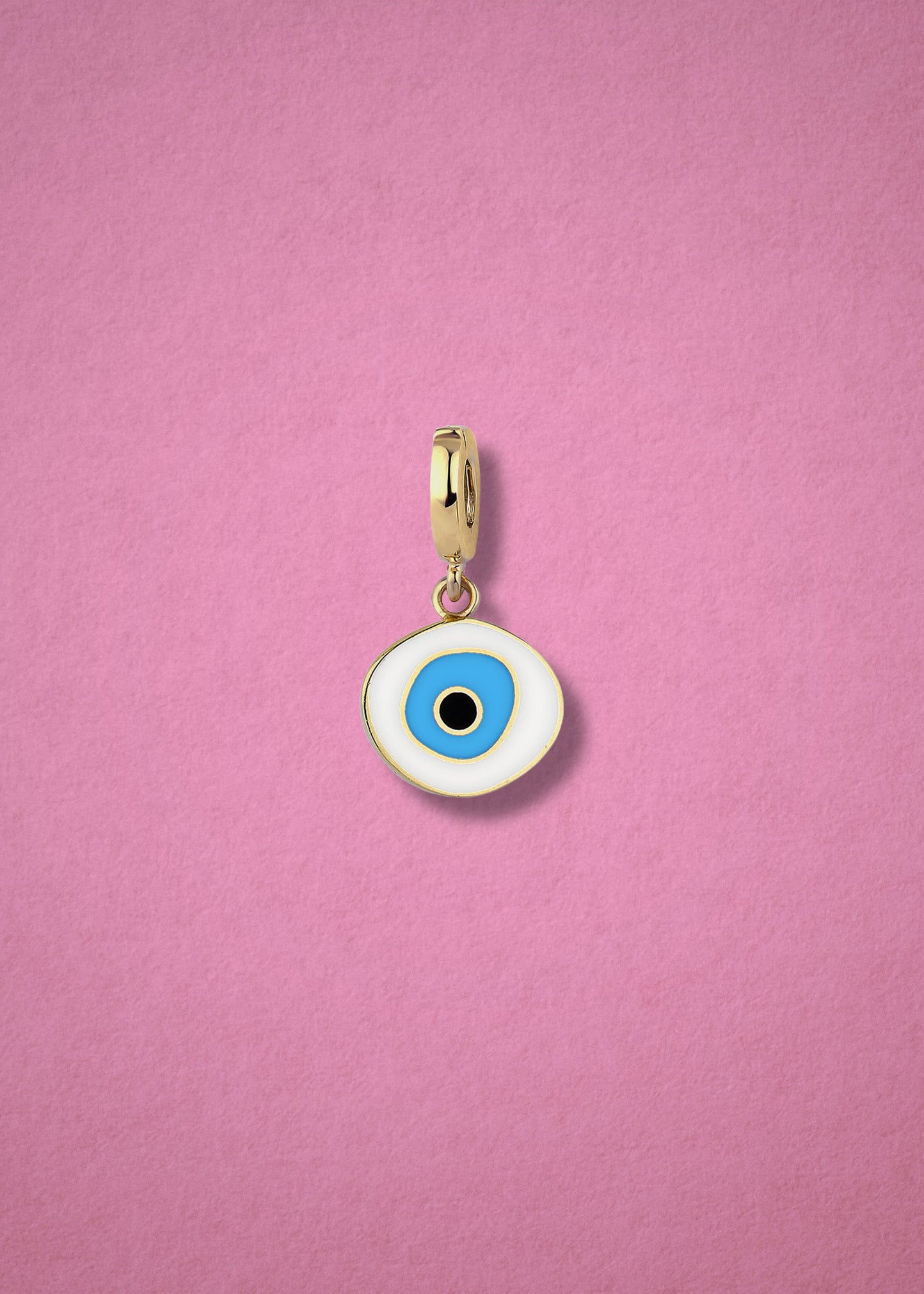 Azure Organic Evil Eye clip-on charm crafted in 14K solid gold with hand-painted white, blue, and black enamel detailing, shown on a soft pink background.