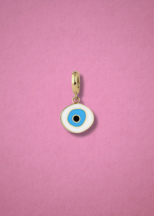 Azure Organic Evil Eye clip-on charm crafted in 14K solid gold with hand-painted white, blue, and black enamel detailing, shown on a soft pink background.