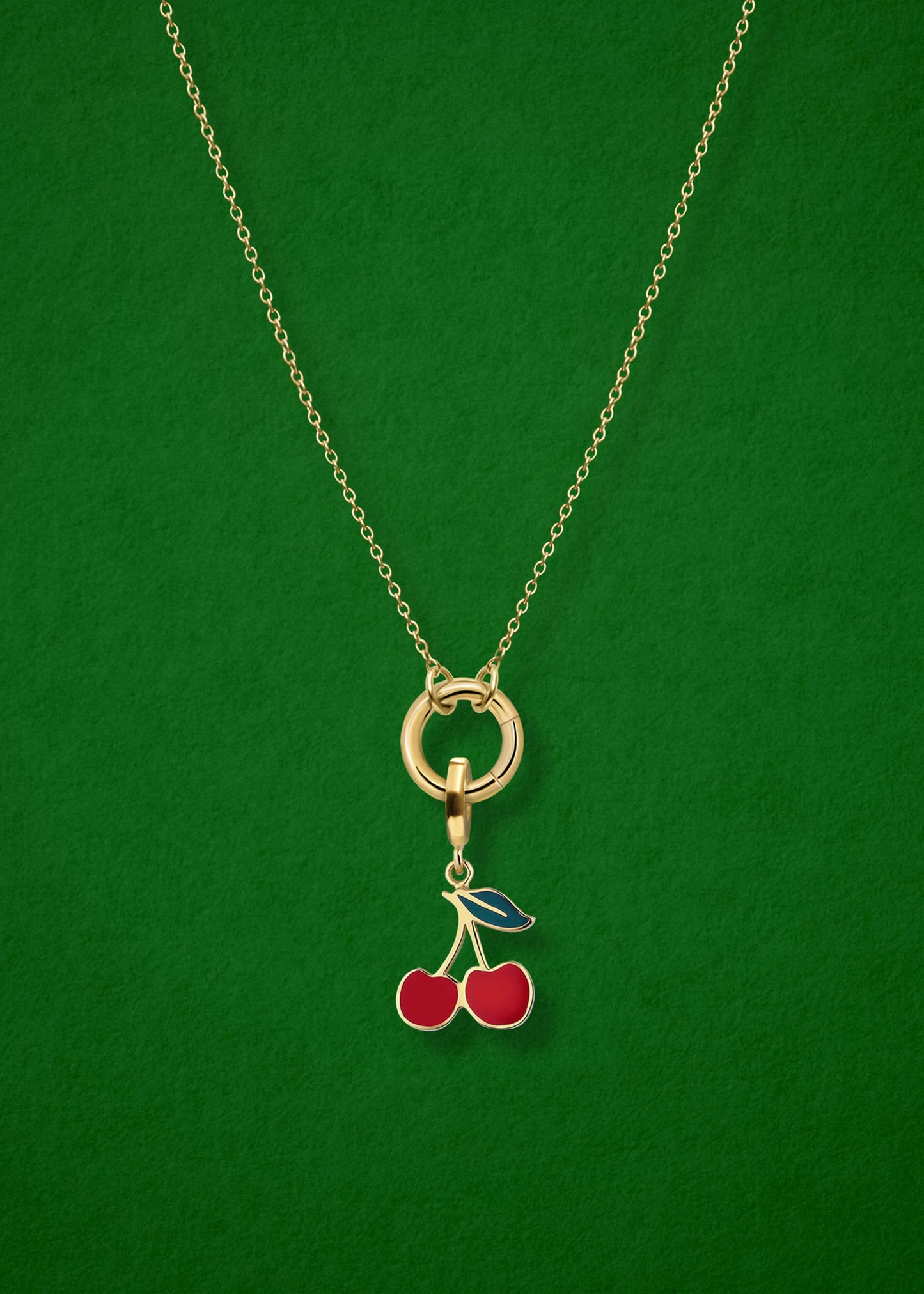 Close-up of the Cherry on Top Charm paired with the Golden Grace Cable Chain, crafted in 14K solid gold by whywhy NYC, for a playful and vibrant jewelry style.