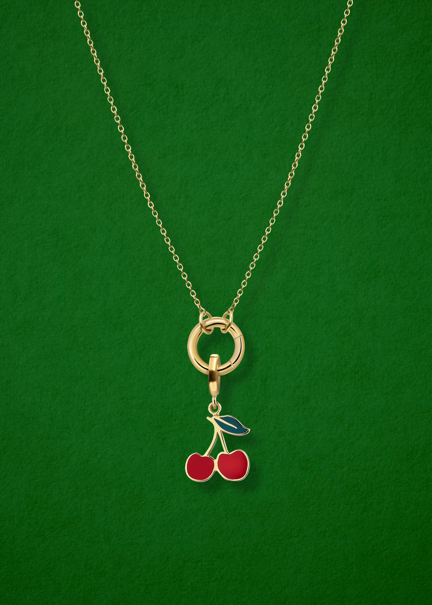 Close-up of the Cherry on Top Charm paired with the Golden Grace Cable Chain, crafted in 14K solid gold by whywhy NYC, for a playful and vibrant jewelry style.
