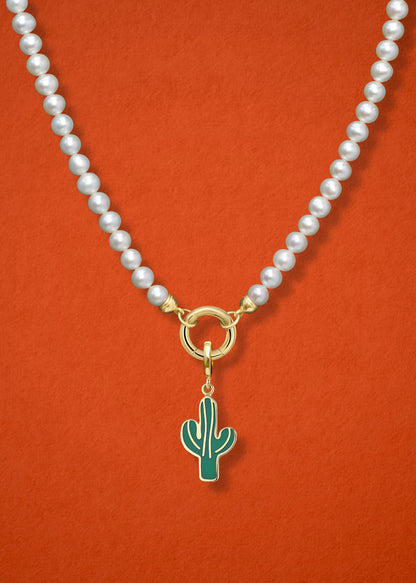 Close-up of the Desert Bloom Charm paired with the Lustrous Pearl Charm Necklace by whywhy NYC, featuring 14K solid gold and freshwater pearls for an elegant yet earthy look.