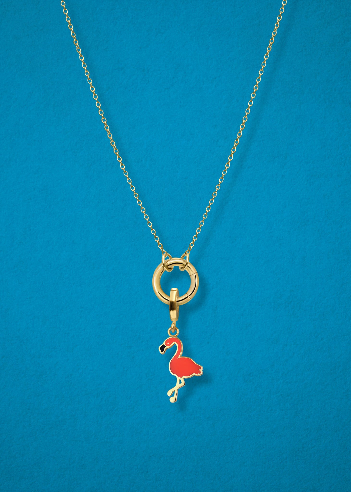 Close-up of the Flamingo Flair Charm paired with the Golden Grace Cable Chain, crafted in 14K solid gold by whywhy NYC, for a bold and tropical jewelry style.
