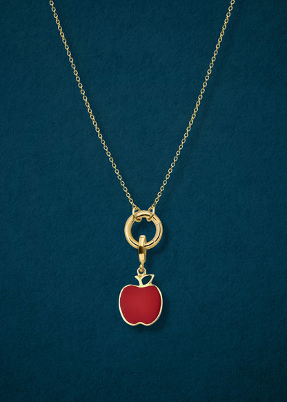 Close-up of the Golden Grace Apple Charm Necklace, featuring a 14K solid gold cable chain, a golden link charm holder, and a golden apple of NYC charm with red enamel by whywhy NYC.