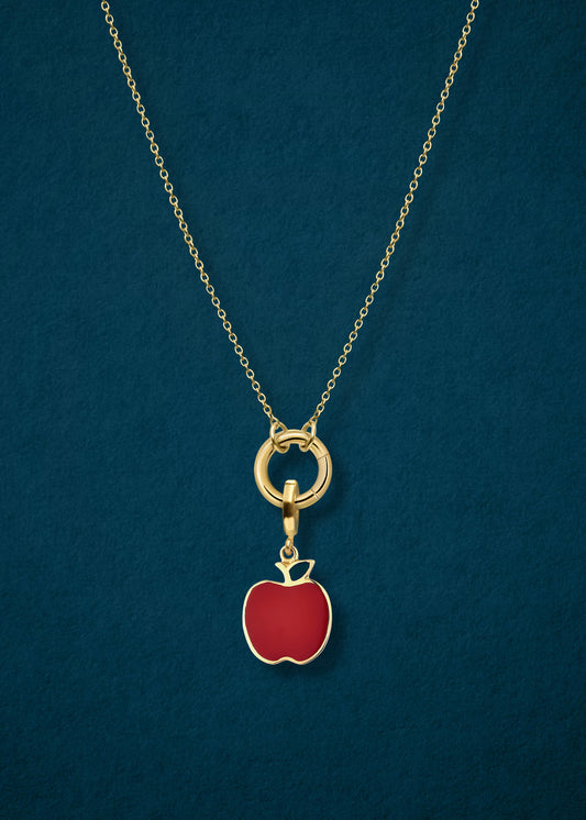 Close-up of the Golden Grace Apple Charm Necklace, featuring a 14K solid gold cable chain, a golden link charm holder, and a golden apple of NYC charm with red enamel by whywhy NYC.