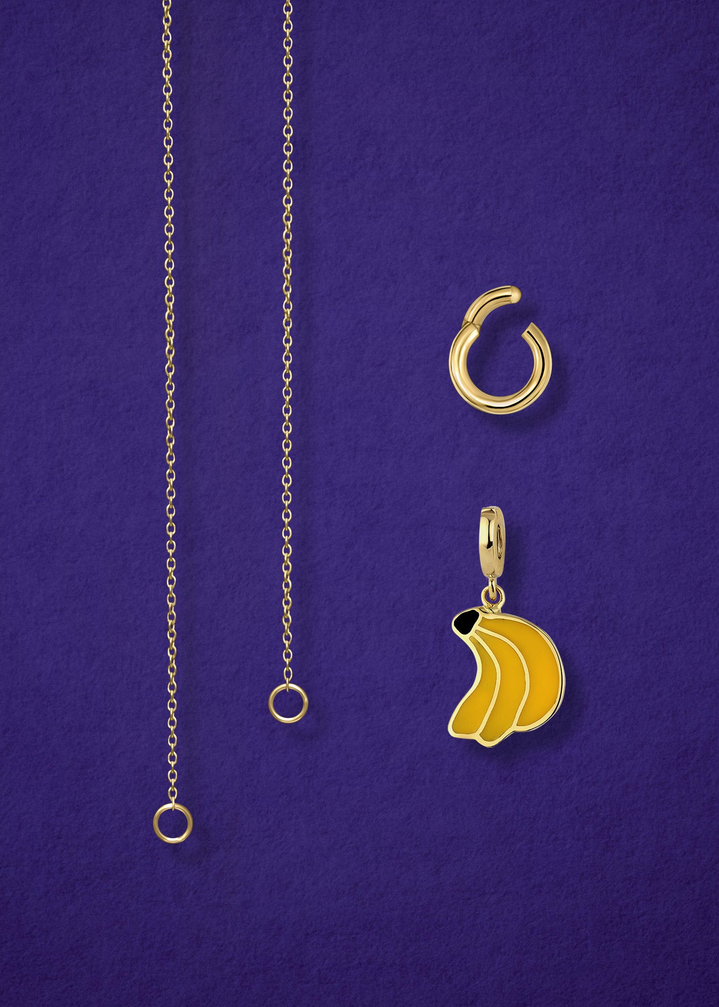 Close-up of the separated Golden Grace Banana Bliss Charm Necklace components: 14K solid gold cable chain, golden link charm holder, and banana bliss charm with yellow enamel by whywhy NYC.