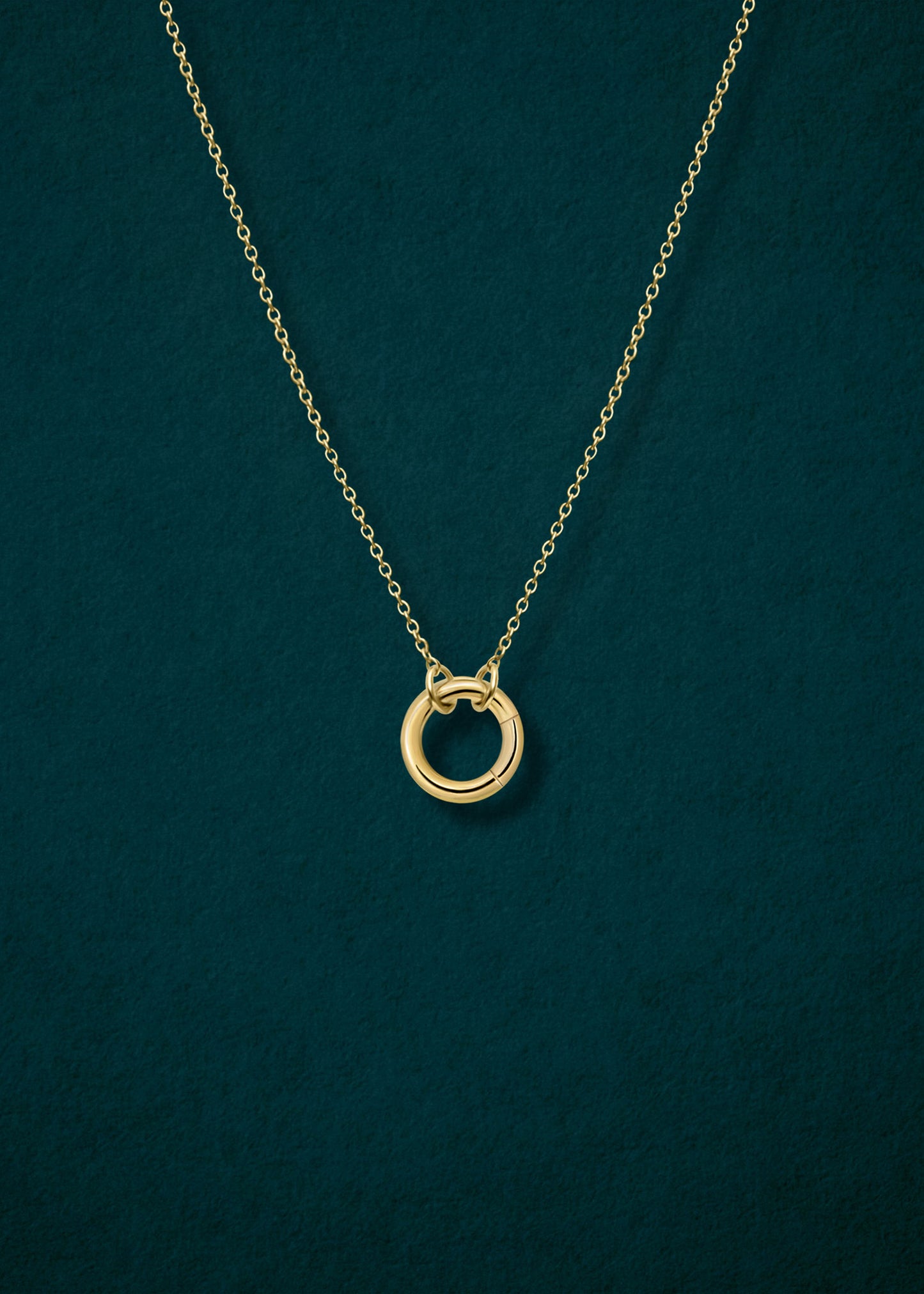 Close-up of 14K solid gold charm holder paired with the Golden Grace Cable Chain by whywhy NYC, showcasing sleek, elegant connections for charm styling.