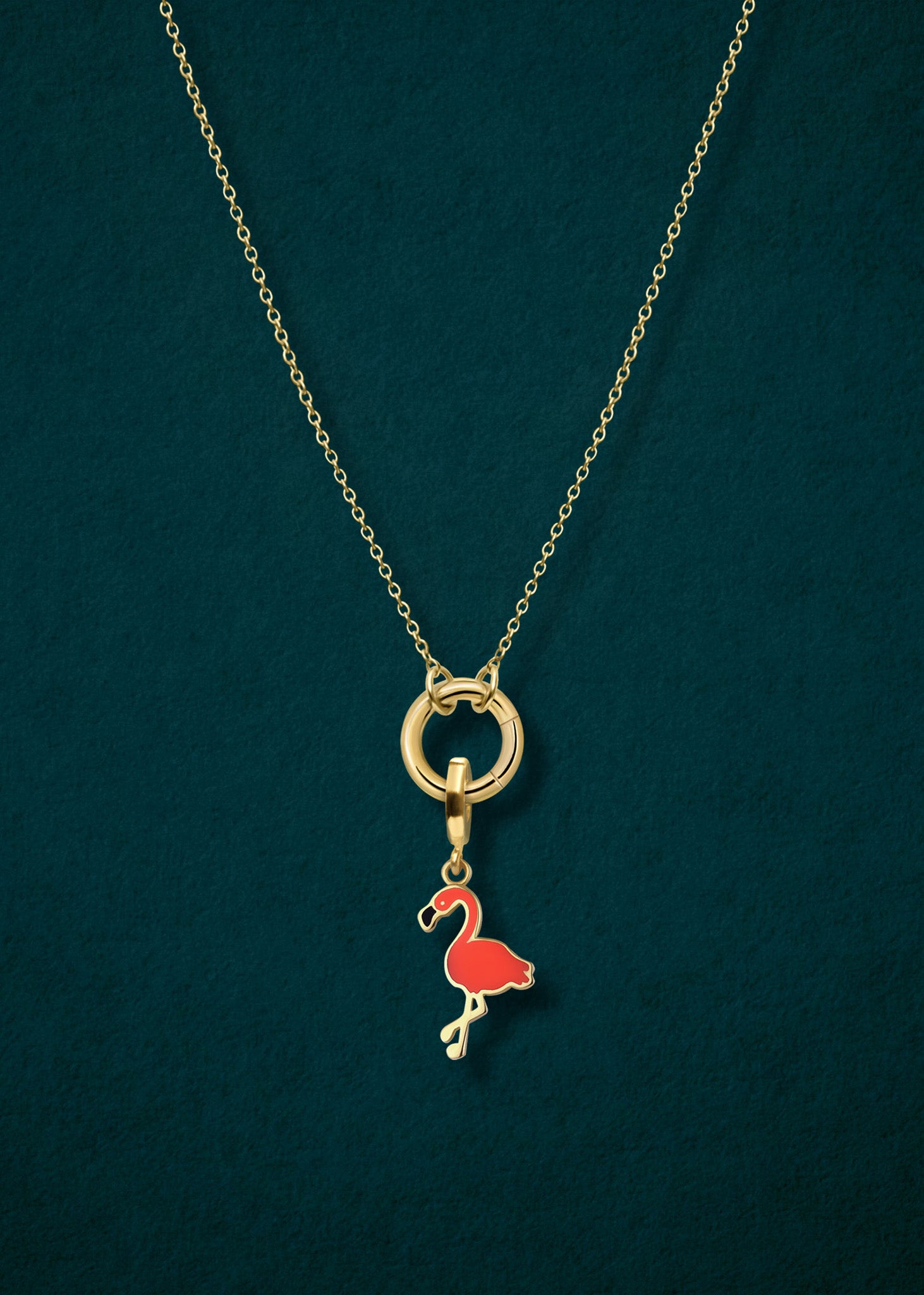Close-up of the Golden Grace Cable Chain paired with the Flamingo Flair Charm by whywhy NYC, featuring sleek 14K solid gold and bold enamel for a tropical, playful touch.