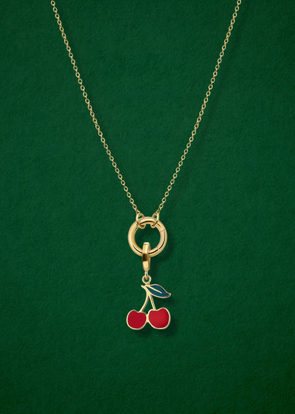 Close-up of the Golden Grace Cherry on Top Charm Necklace, featuring a 14K solid gold cable chain, a golden link charm holder, and a cherry on top charm with red enamel by whywhy NYC.