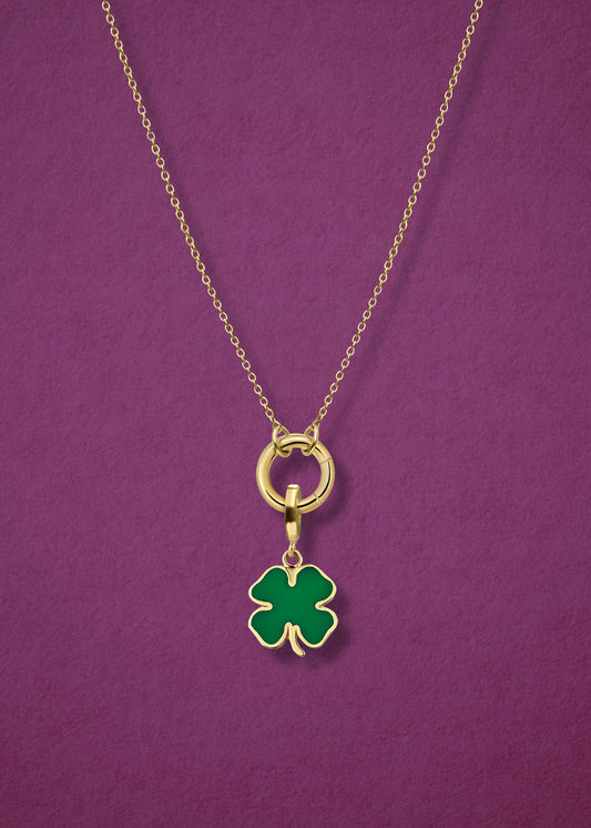 Close-up of the Golden Grace Lucky Clover Charm Necklace, featuring a 14K solid gold cable chain, a golden link charm holder, and a lucky clover charm with green enamel by whywhy NYC.