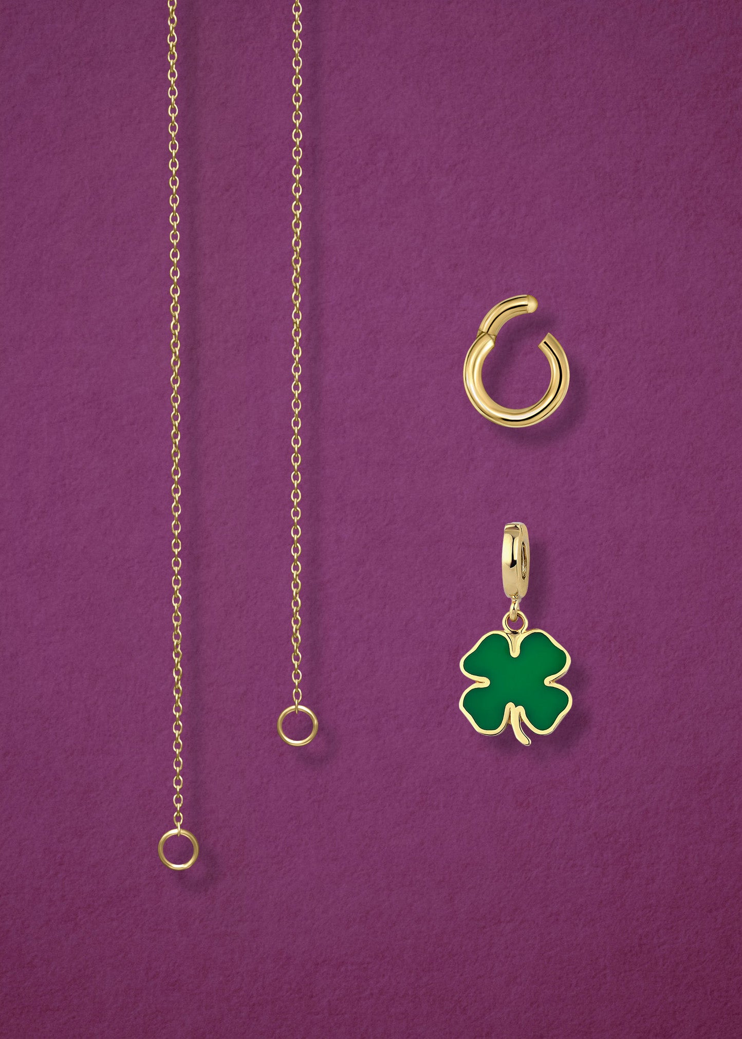 Close-up of the separated Golden Grace Lucky Clover Charm Necklace components: 14K solid gold cable chain, golden link charm holder, and lucky clover charm with green enamel by whywhy NYC.