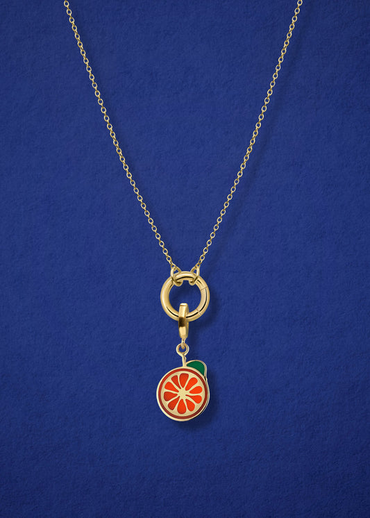 Close-up of the Golden Grace Orange Crush Charm Necklace, featuring a 14K solid gold cable chain, a golden link charm holder, and an orange crush charm with orange enamel by whywhy NYC.