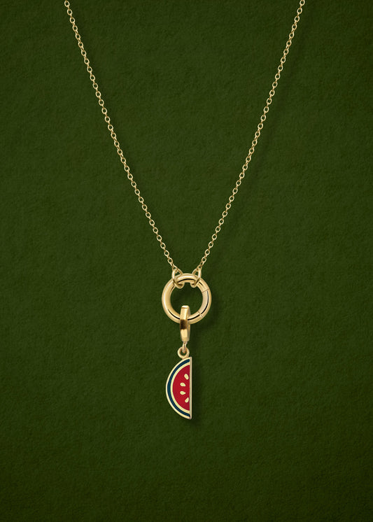 Close-up of the Golden Grace Watermelon Wonder Charm Necklace, featuring a 14K solid gold cable chain, a golden link charm holder, and a watermelon wonder charm with pink and green enamel by whywhy NYC.