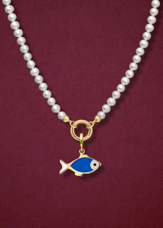 Close-up of the Lustrous Pearl Fishy Wishes Charm Necklace, featuring freshwater pearls, a golden link charm holder, and a fishy wishes charm in 14K solid gold by whywhy NYC.