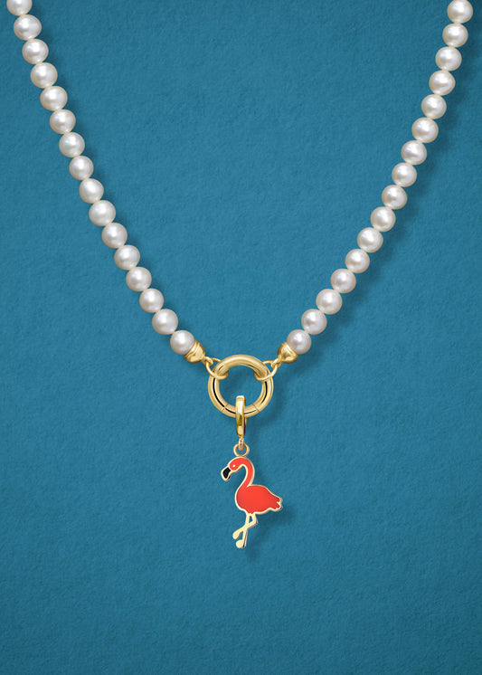 Close-up of the Lustrous Pearl Flamingo Flair Charm Necklace, featuring freshwater pearls, a golden link charm holder, and a flamingo flair charm in 14K solid gold by whywhy NYC.