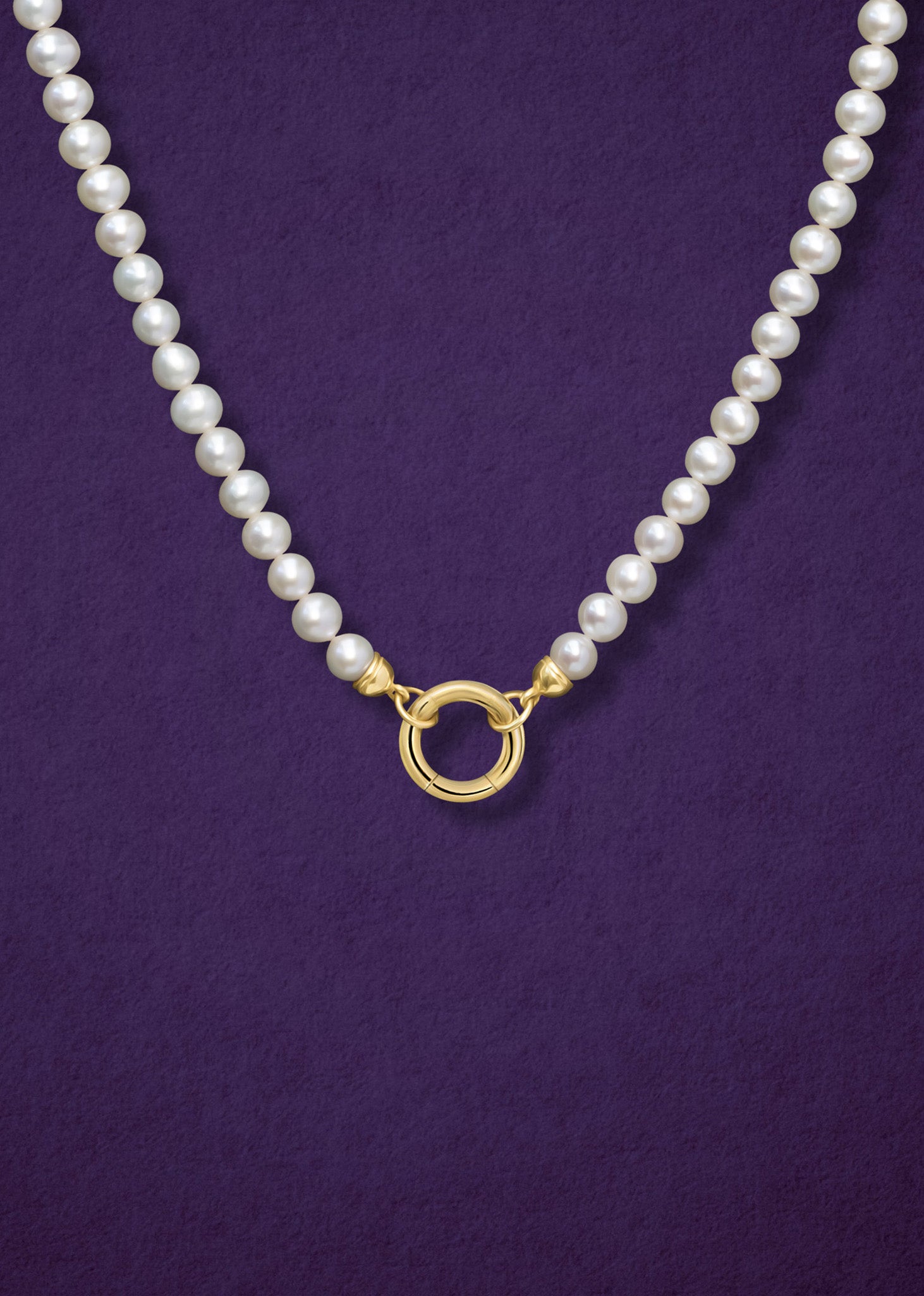 Close-up of 14K solid gold charm holder paired with the Lustrous Pearl Charm Necklace by whywhy NYC, highlighting its secure and stylish design for personalized charm combinations.