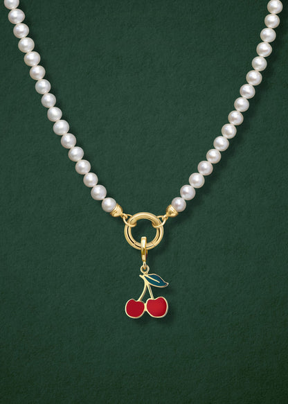Close-up of the Lustrous Pearl Cherry on Top Charm Necklace, featuring freshwater pearls, a golden link charm holder, and a cherry on top charm in 14K solid gold by whywhy NYC.