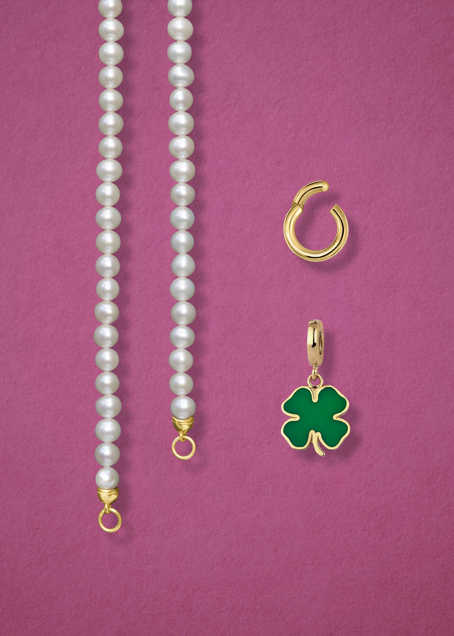 Close-up of the separated Lustrous Pearl Lucky Clover Charm Necklace components: pearl necklace, golden link charm holder, and lucky clover charm in 14K solid gold by whywhy NYC.