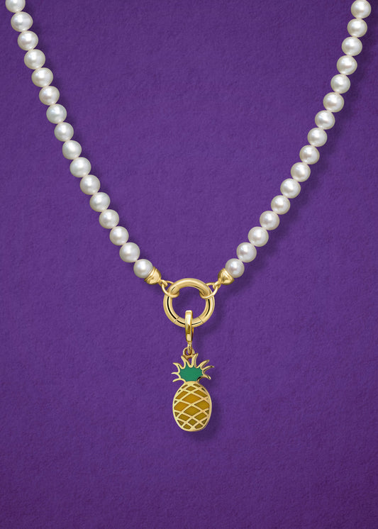 Close-up of the Lustrous Pearl Pineapple Paradise Charm Necklace, featuring freshwater pearls, a golden link charm holder, and a pineapple paradise charm in 14K solid gold by whywhy NYC.