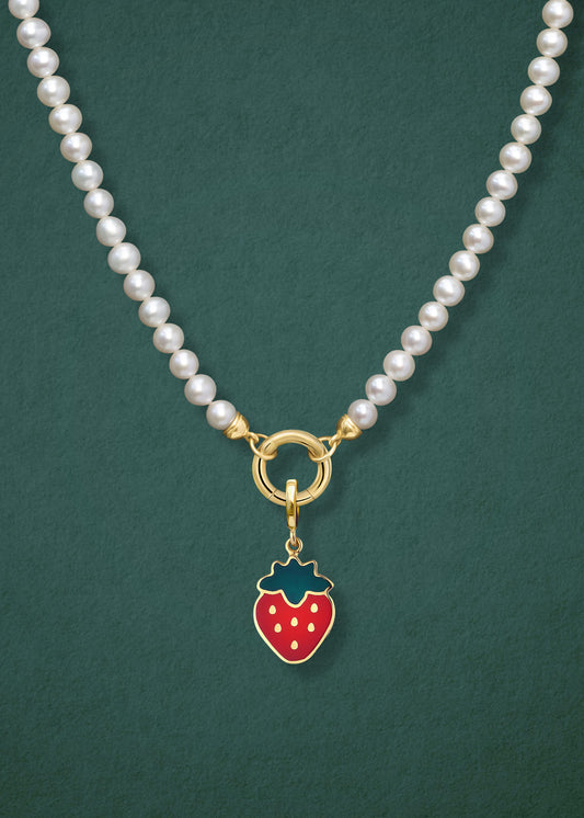 Close-up of the Lustrous Pearl Sweet Strawberry Charm Necklace, featuring freshwater pearls, a golden link charm holder, and a sweet strawberry charm in 14K solid gold by whywhy NYC.