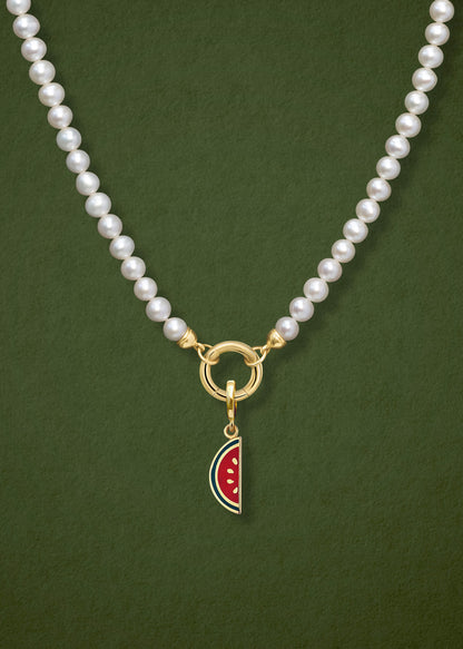 Close-up of the Lustrous Pearl Watermelon Wonder Charm Necklace, featuring freshwater pearls, a golden link charm holder, and a watermelon wonder charm in 14K solid gold by whywhy NYC.