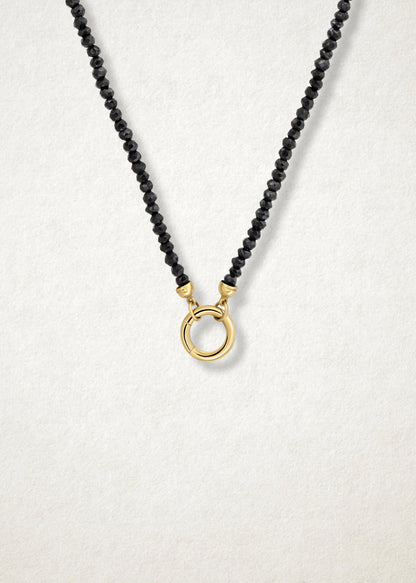 Close-up of 14K solid gold charm holder paired with the Noir Elegance Charm Necklace by whywhy NYC, featuring a bold and versatile connection for charm designs.