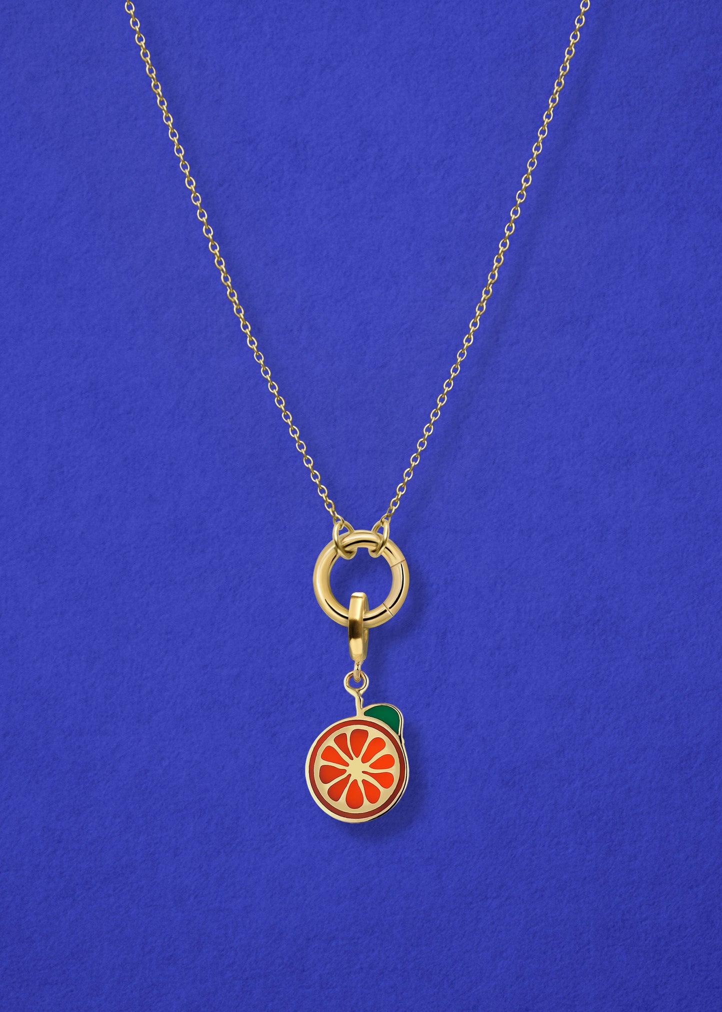 Close-up of the Orange Crush Charm paired with the Golden Grace Cable Chain, crafted in 14K solid gold by whywhy NYC, for a vibrant and stylish jewelry option.