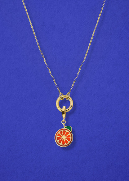 Close-up of the Orange Crush Charm paired with the Golden Grace Cable Chain, crafted in 14K solid gold by whywhy NYC, for a vibrant and stylish jewelry option.