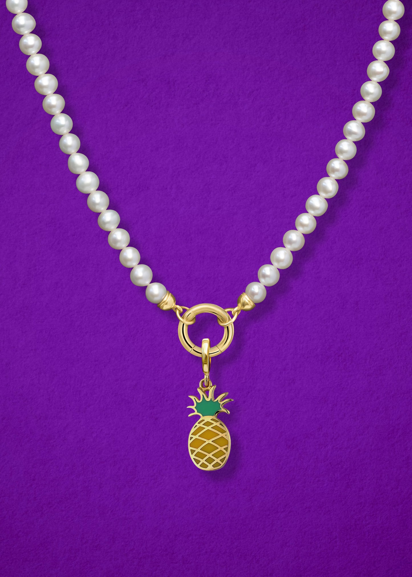 Close-up of the Pineapple Paradise Charm paired with the Lustrous Pearl Charm Necklace by whywhy NYC, featuring 14K solid gold and freshwater pearls for an elegant yet whimsical style.