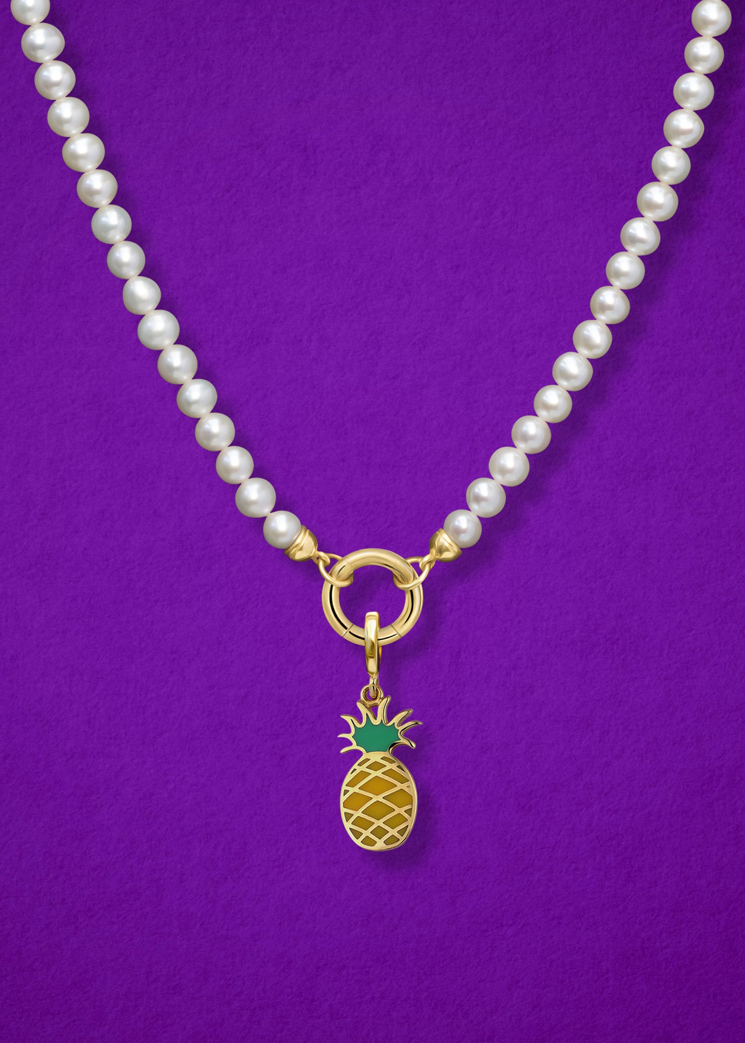 Close-up of the Pineapple Paradise Charm paired with the Lustrous Pearl Charm Necklace by whywhy NYC, featuring 14K solid gold and freshwater pearls for an elegant yet whimsical style.