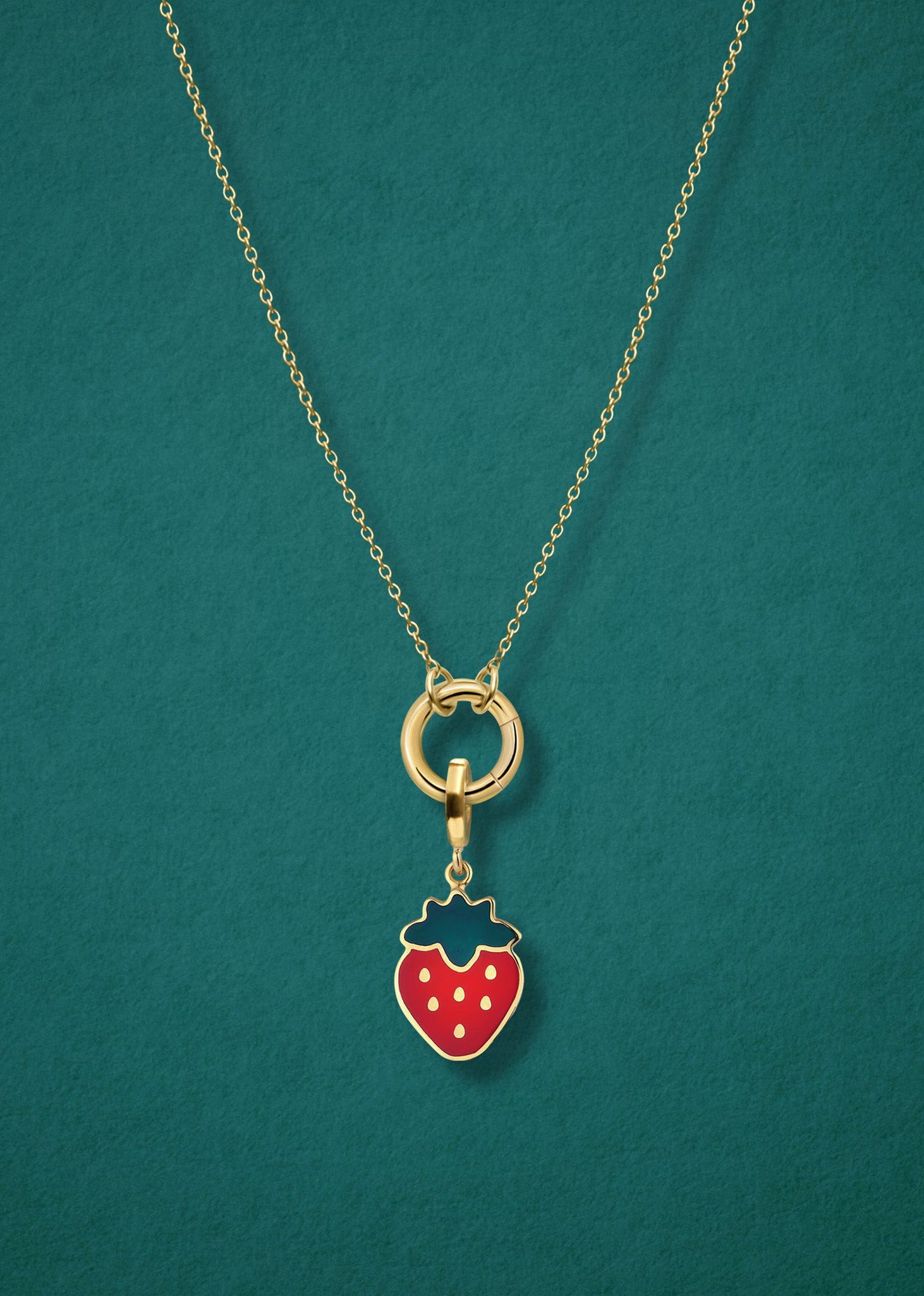 Close-up of the Sweet Strawberry Delight Charm paired with the Golden Grace Cable Chain, crafted in 14K solid gold by whywhy NYC, for a vibrant and playful jewelry style.