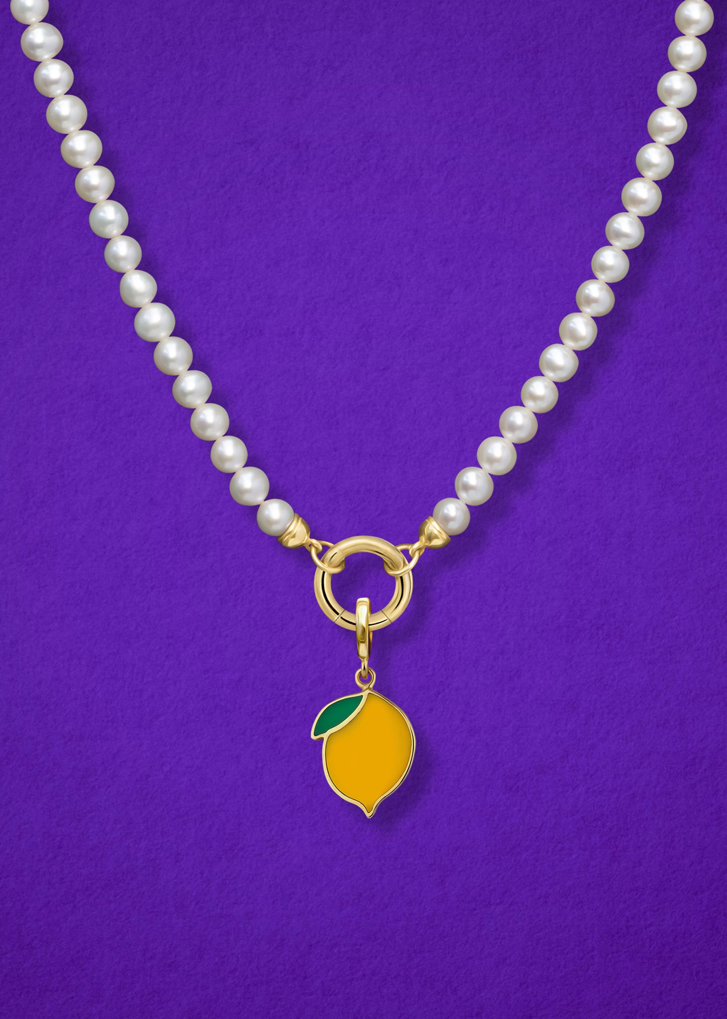 Close-up of the Zesty Lemon Charm paired with the Lustrous Pearl Charm Necklace by whywhy NYC, featuring 14K solid gold and freshwater pearls for a timeless yet playful look.