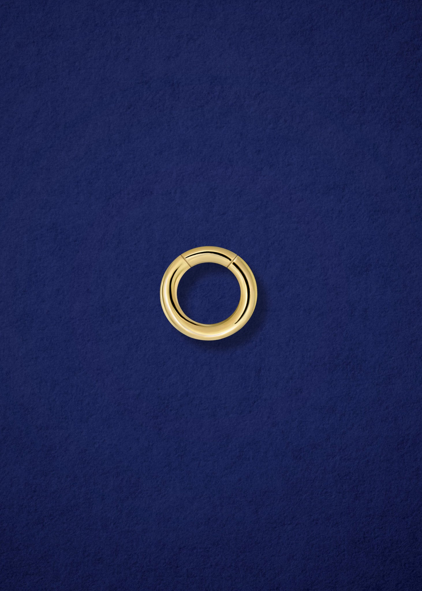 Closed 14K solid gold charm holder by whywhy NYC, designed for easy connection of necklaces and charms.
