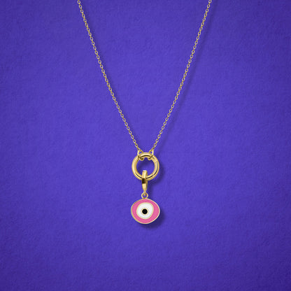 Close-up of the Blush Organic Evil Eye Charm with hand-painted enamel on a 14K solid gold cable chain necklace, shown on a lilac background.