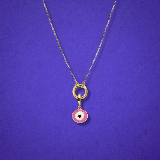 Close-up of the Blush Organic Evil Eye Charm with hand-painted enamel on a 14K solid gold cable chain necklace, shown on a lilac background.