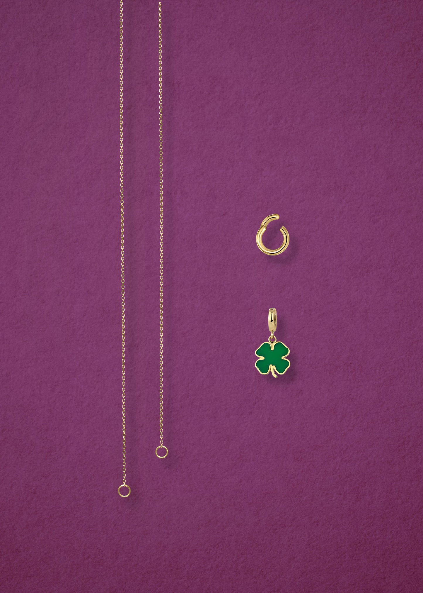 Separated components of the Golden Grace Lucky Clover Charm Necklace, including 14K solid gold cable chain, golden link charm holder, and lucky clover charm with green enamel by whywhy NYC.