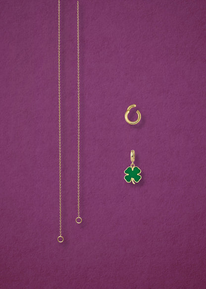 Separated components of the Golden Grace Lucky Clover Charm Necklace, including 14K solid gold cable chain, golden link charm holder, and lucky clover charm with green enamel by whywhy NYC.